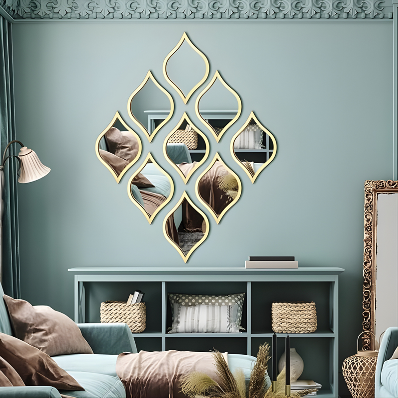 ArcDew Leaf Shape Acrylic Mirror Decals Gold Trim Modern Decor UAE - arcdew.com - ArcDew branded gold-trimmed acrylic leaf shape mirror decals arranged on a teal wall.