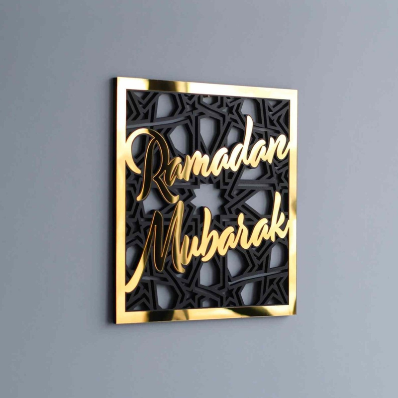 Decorative wall art with 'Ramadan Mubarak' text on a gray background