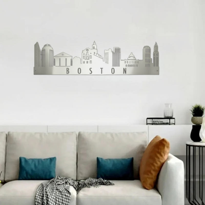 ArcDew Boston Skyline Acrylic Wall Art – Modern City Décor - arcdew.com - Silver ArcDew branded acrylic Boston skyline wall art above sofa with cushions.
