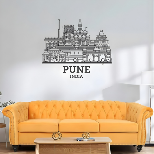 ArcDew: Pune, India City Skyline Wall Art for UAE Homes - arcdew.com - ArcDew black acrylic Pune India city skyline wall art above yellow sofa.