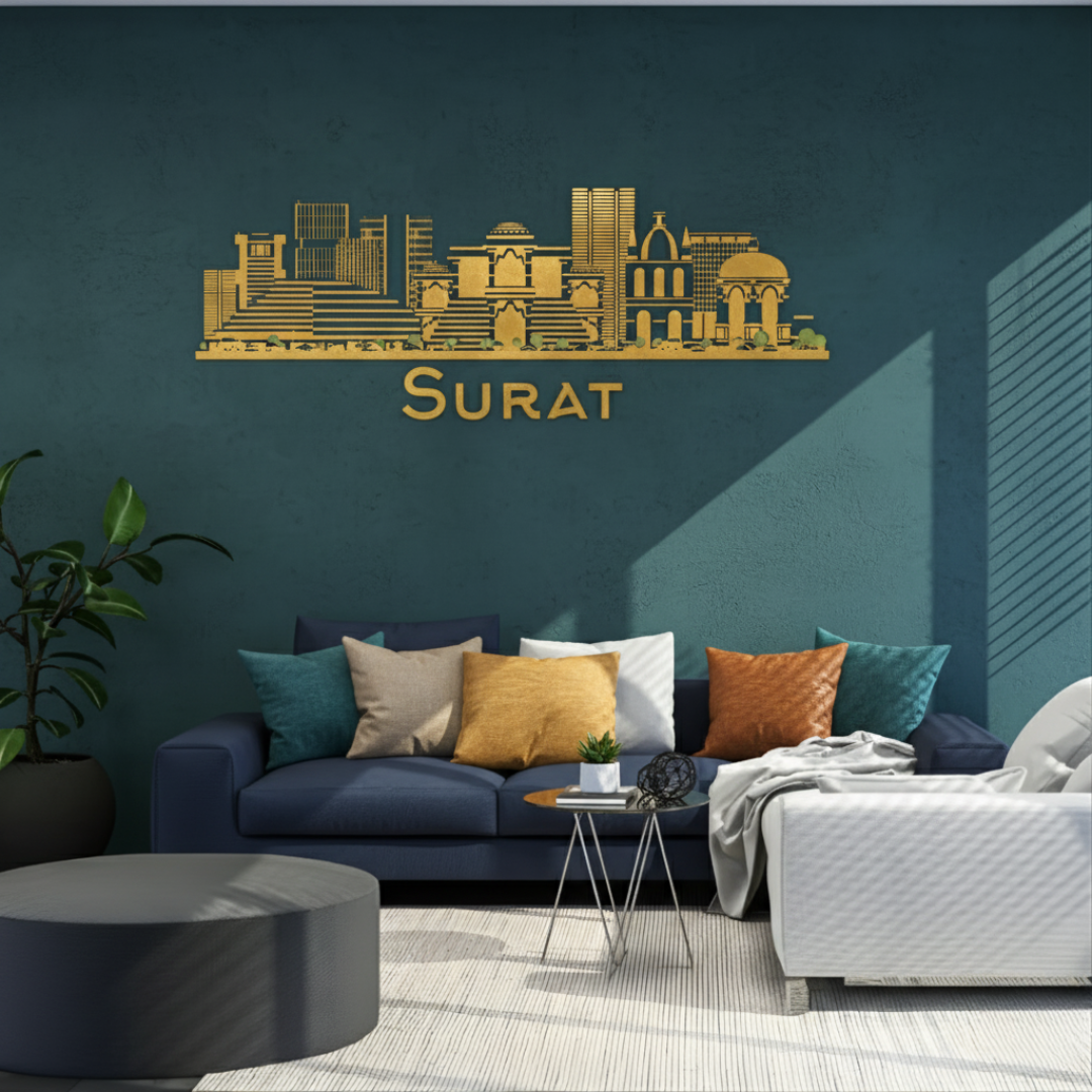 ArcDew: Surat, India City Skyline Wall Art Decal | Heritage Decor for UAE - arcdew.com - Gold acrylic ArcDew branded Surat city skyline wall art decal above blue sofa.