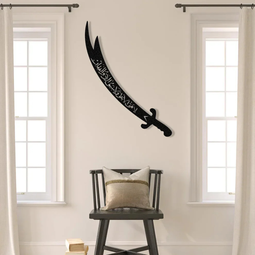 ArcDew Zulfiqar Sword Hazrat Alis Sword Moharram Decal UAE - arcdew.com - Black acrylic ArcDew Zulfiqar sword wall decal with Islamic calligraphy above chair.