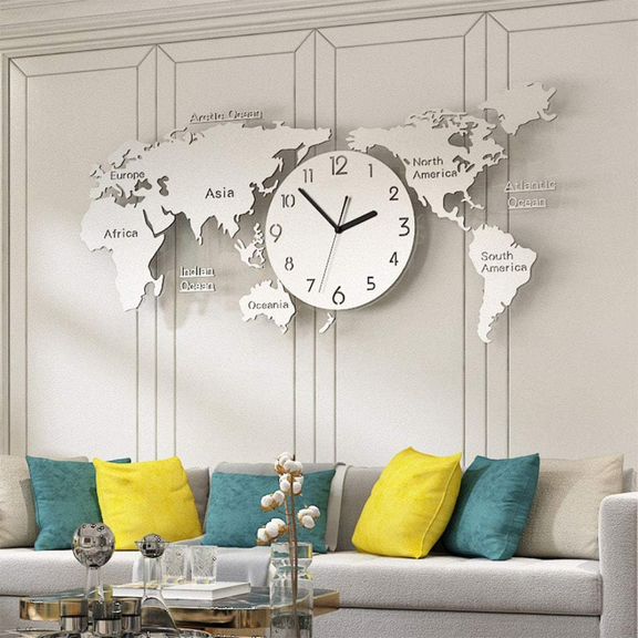 World map wall clock in a living room with a sofa and decorative pillows.