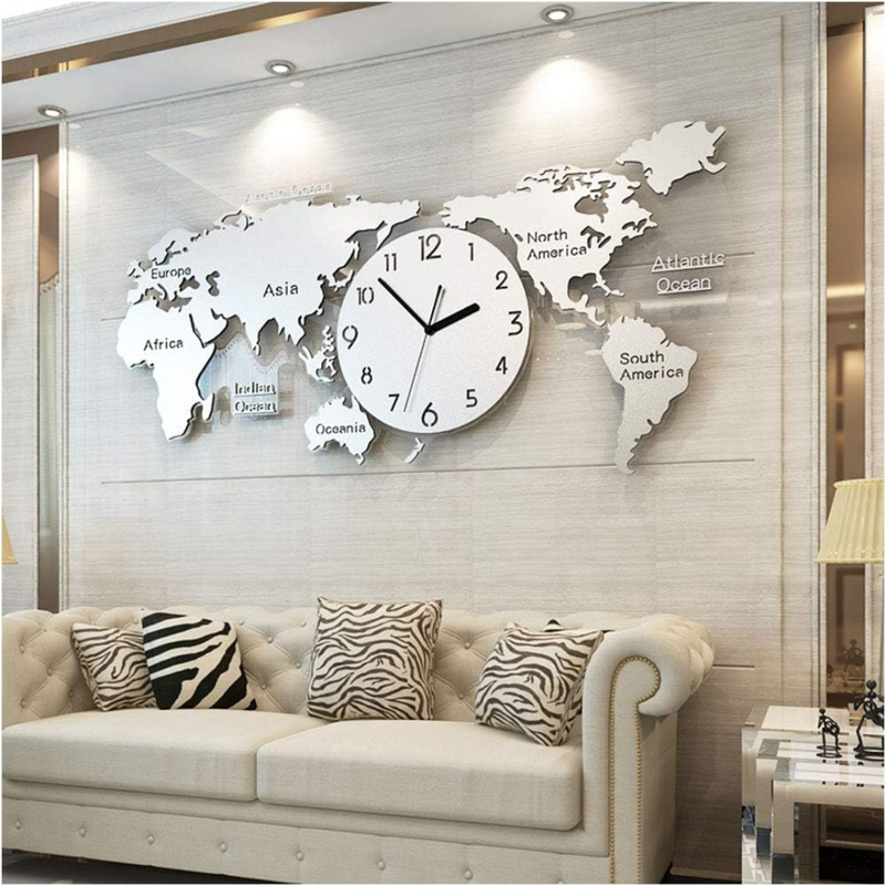 World map wall clock in a living room setting with a sofa and decorative pillows.