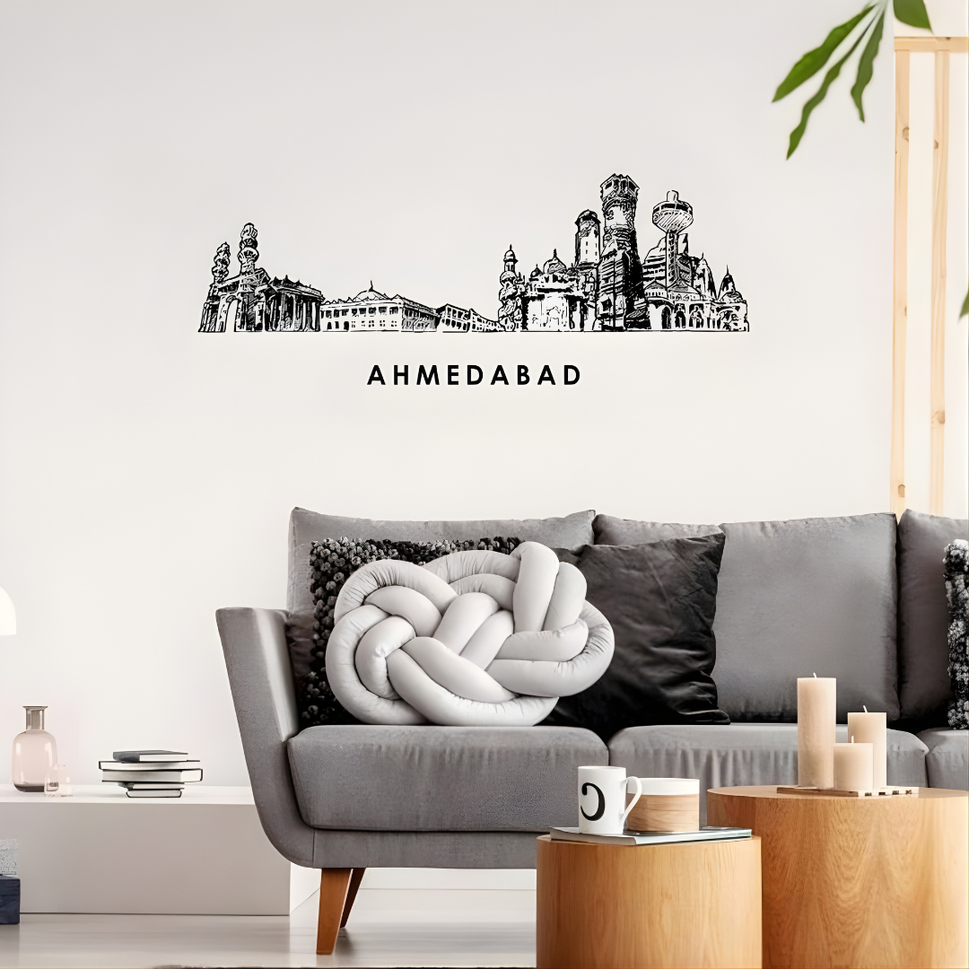 Arcdew Acrylic Black Ahmedabad Skyline Wall Art for Home Decor - arcdew.com - Arcdew branded acrylic wall art featuring black Ahmedabad skyline above modern gray sofa with decorative cushions.