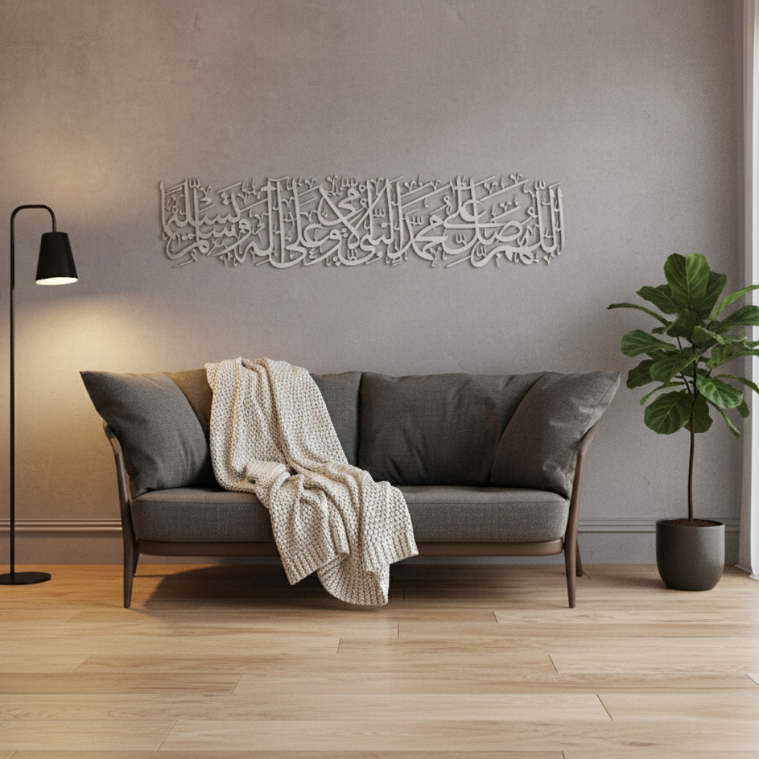 Arcdew Darood Sharif (Salawat) Islamic Wall Art – Arabic Calligraphy Home Decor - arcdew.com - Arcdew branded silver acrylic Arabic calligraphy wall art above gray sofa with knitted throw.
