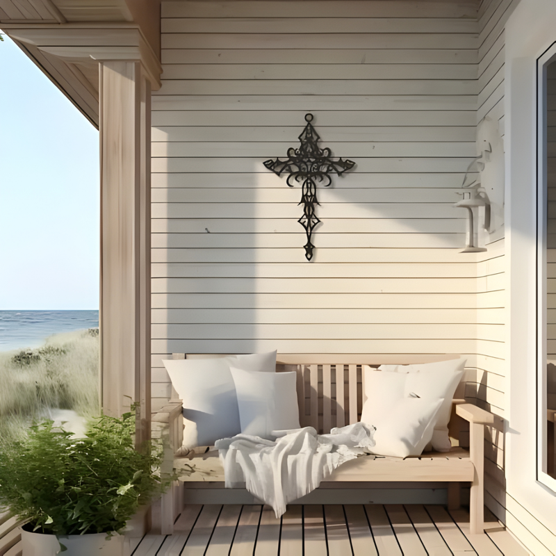 Arcdew Design Christian Wall Décor UAE | Christmas & Baptism Gift for Church & Home - arcdew.com - Black Arcdew branded acrylic Christian wall decor cross on white shiplap above wooden bench with cushions and throw on porch.