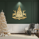 Decorative wall art with reindeer and a Christmas tree on a dark green wall, with a Christmas tree and presents in the foreground.