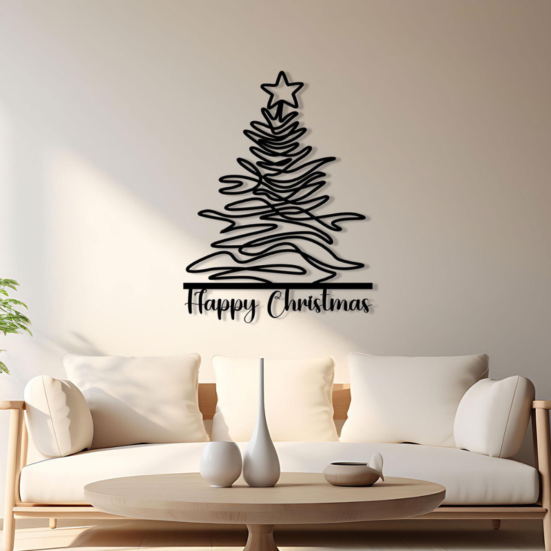 Black Christmas tree wall decal with 'Happy Christmas' text on a beige wall above a white sofa.