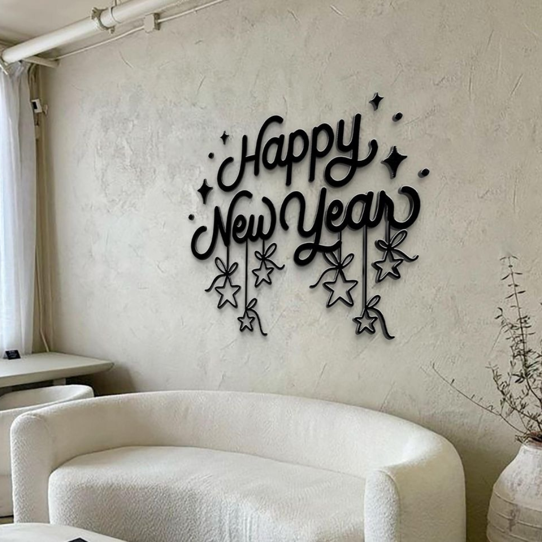 Decorative wall art with 'Happy New Year' text on a plain wall.