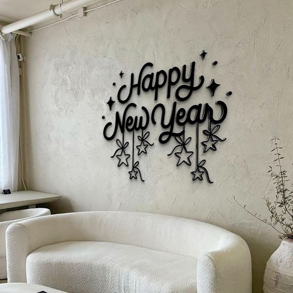 Decorative wall art with 'Happy New Year' text on a plain wall.