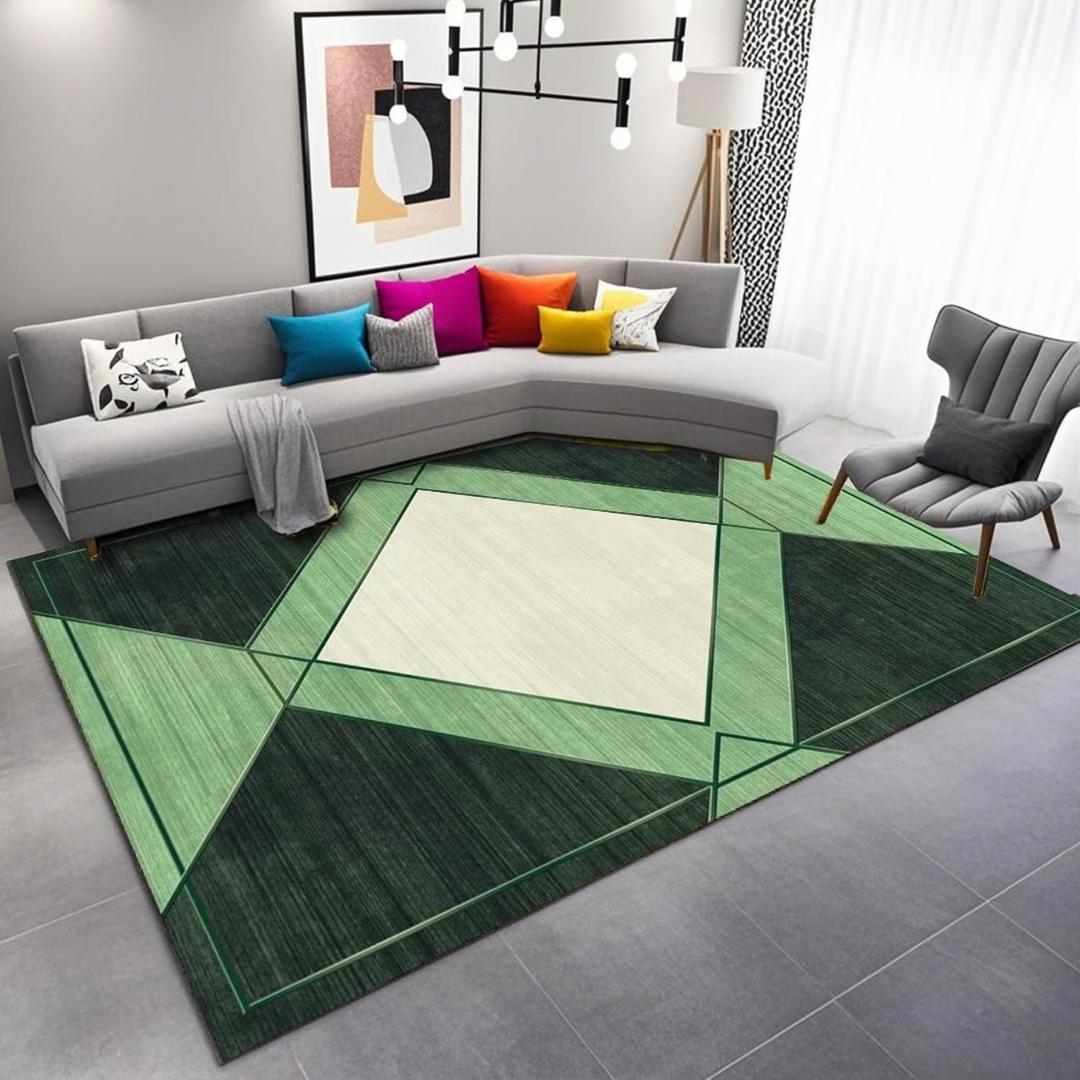 Living room with a green geometric rug, gray sectional sofa, and colorful pillows.