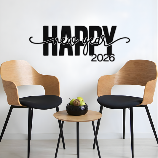 Two wooden chairs with black seats and legs, a small round table, and a 'Happy New Year 2026' wall decal on a white wall.