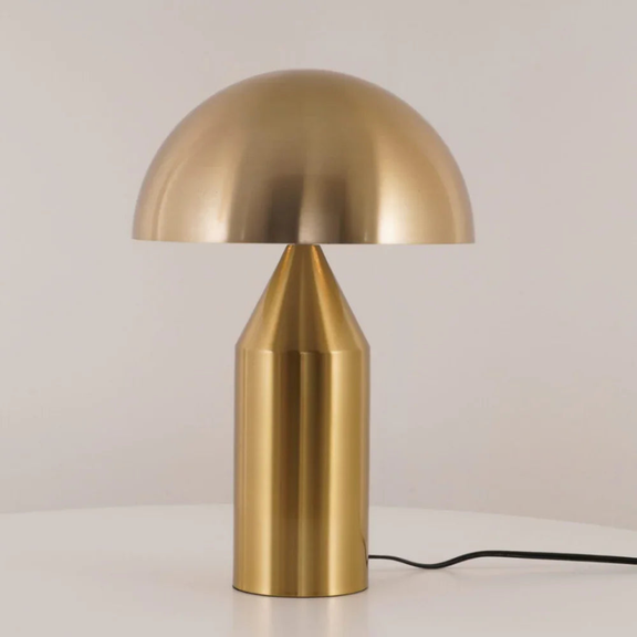 Gold table lamp on a light background